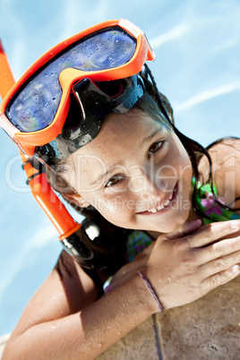 Happy Girl In A Swimming Pool with Goggles and Snorkel