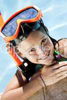 Happy Girl In A Swimming Pool with Goggles and Snorkel