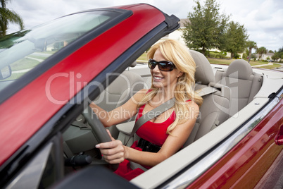 Beautiful Young Woman Driving Convertible Car Wearing Sunglasses