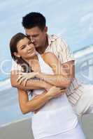 Man and Woman Couple Having In Romantic Embrace On Beach