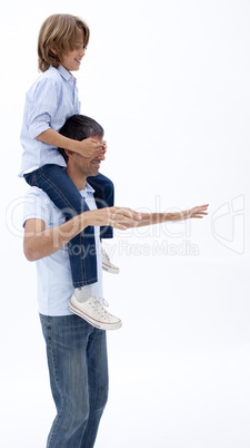 Man giving son piggyback ride with eyes closed