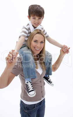 Woman giving little boy piggyback ride