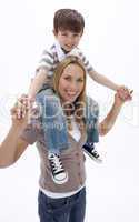 Woman giving little boy piggyback ride