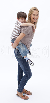 Mother giving son piggyback ride