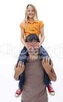 Father giving daughter piggyback ride with closed eyes