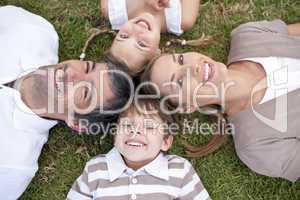 Tired family lying in a park