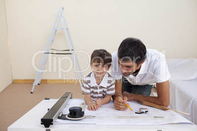 Father and son studying architecture at home