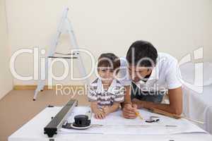 Father and son studying architecture at home