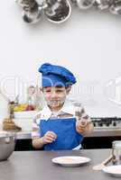 Little child ready to bake