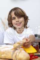 Smiling child eating bread