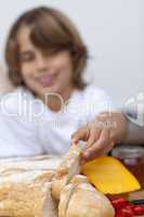 Smiling child taking a piece of bread
