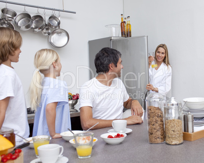 Family preparing breakfast in the kitchen