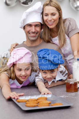 Family eating cookies after baking