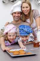 Family eating cookies after baking