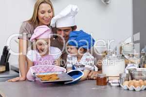 Happy family baking cookies in the kitchen