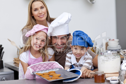 Family baking biscuits in the kitchen