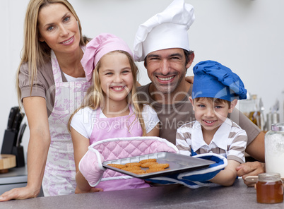 Family baking cookies in the kitchen