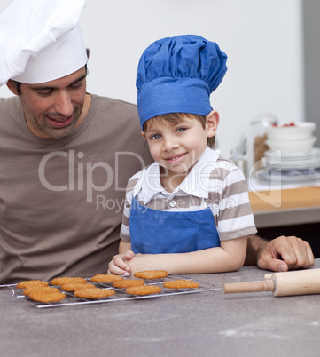 Father and son baking in the kitchen