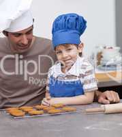 Father and son baking in the kitchen