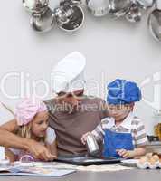 Father baking cookies with his children