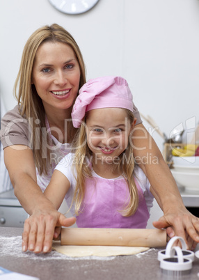 Mother and daughter baking in the kitchen