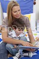 Mother reading a book with her son