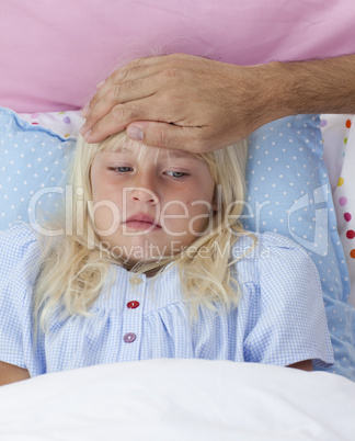 Sick girl in bed having flu
