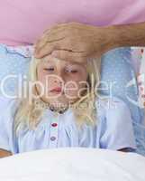 Sick girl in bed having flu