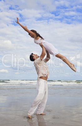 Yong Man and Woman Couple, Jumping in Celebration On Beach