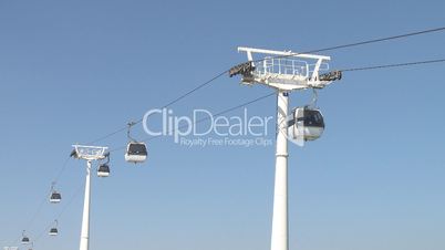 Cable car working against blue sky