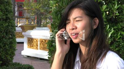 Asian Girl Talking On A Cell Phone