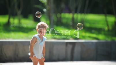The girl and soap bubbles