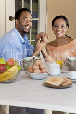 Happy African American Couple Sitting Outside Having A Healthy B
