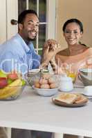 Happy African American Couple Sitting Outside Having A Healthy B