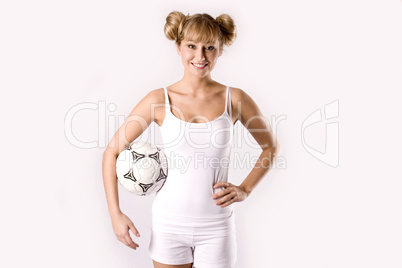 young blonde in sportswear with a football