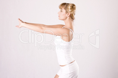 young woman makes athletic exercises
