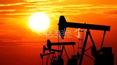 Loopable oil pumps (jackpumps) at sunset