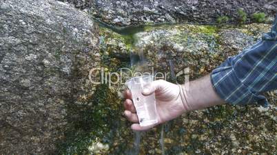 Fresh water source flowing among stones
