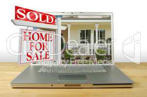 Sold Home For Sale Sign on Laptop
