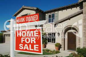 Bank Owned Home For Sale Sign in Front of New House
