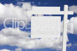 Blank Real Estate Sign on Clouds & Sky Background