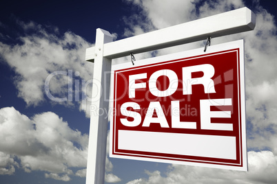 For Sale Real Estate Sign on Cloudy Sky