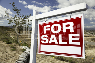 For Sale Real Estate Sign and Emtpy Construction Lots