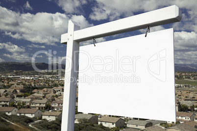 Blank Real Estate Sign Over Elevated Housing Community View