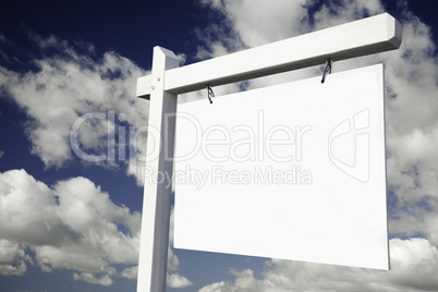 Blank Real Estate Sign on Cloudy Sky