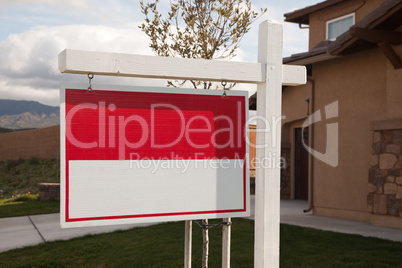 Blank Real Estate Sign in Front of House