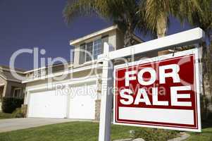 For Sale Real Estate Sign and House