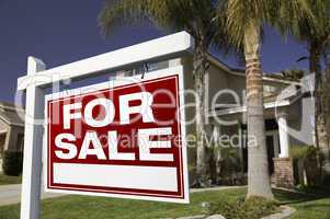 For Sale Real Estate Sign and House