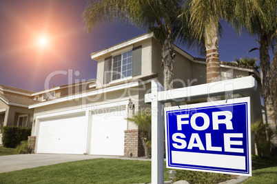 Red For Sale Real Estate Sign and House