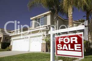 Red For Sale Real Estate Sign and House